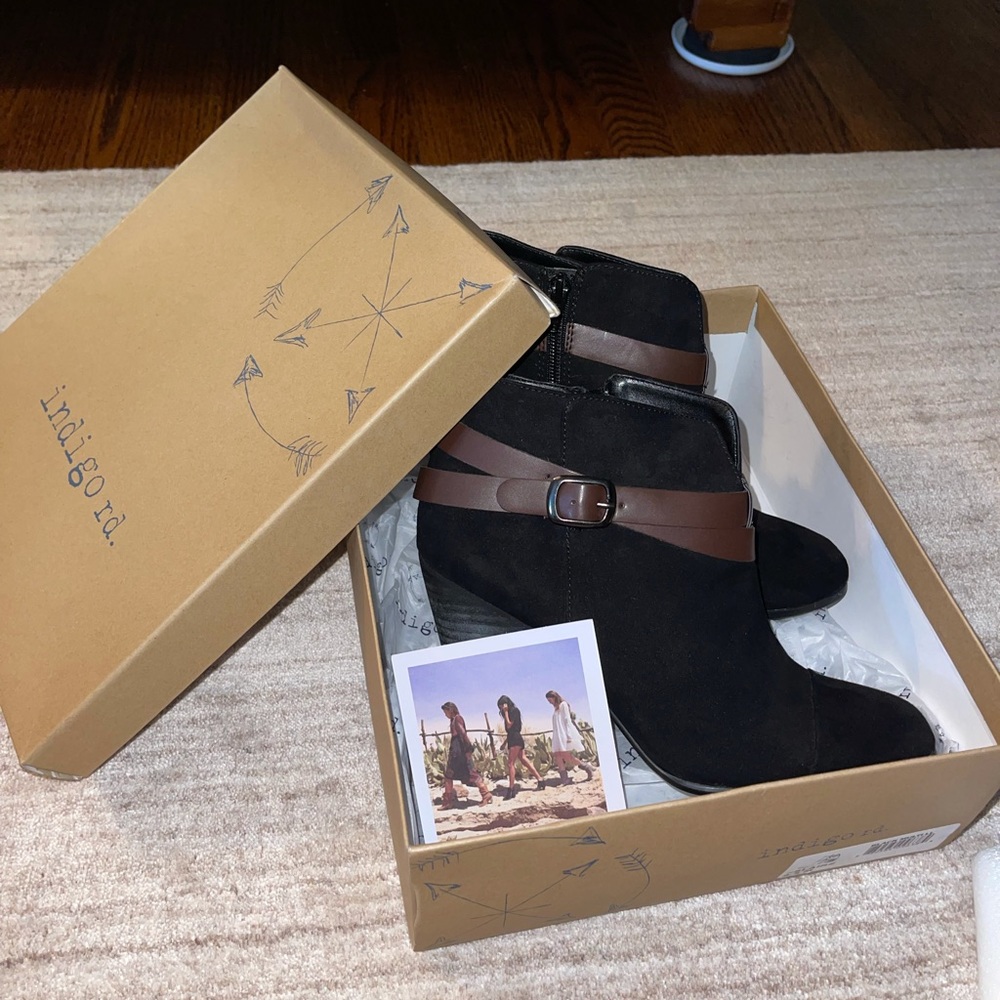 New black suede heeled booties with brown belts